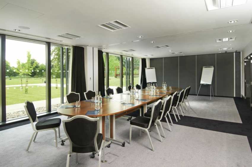 Empire set up in a boardroom style, perfect for a productive meeting.