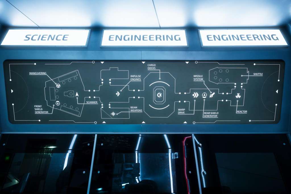 Interior corridor with illuminated signage reading Science and Engineering, displaying a technical schematic diagram on wall panel.