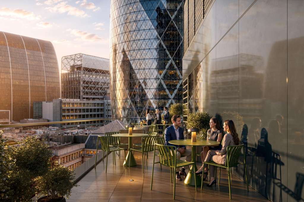 Rooftop terrace with city skyline views, green furniture, and seated guests in evening light.
