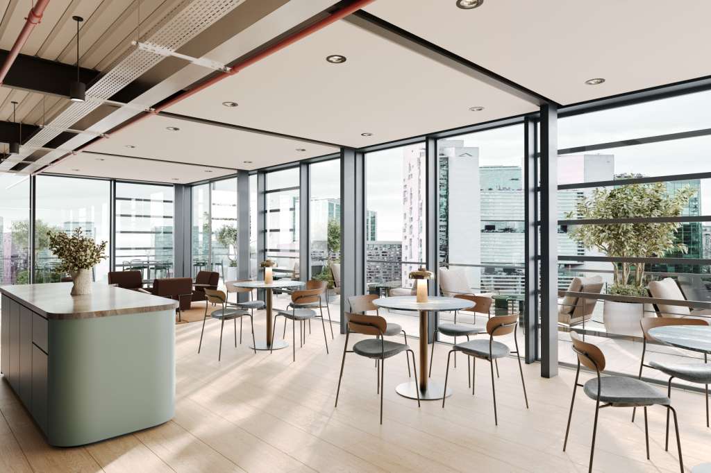 Modern conference space with curved bar counter, high ceilings, floor-to-ceiling windows overlooking cityscape, and scattered seating areas.